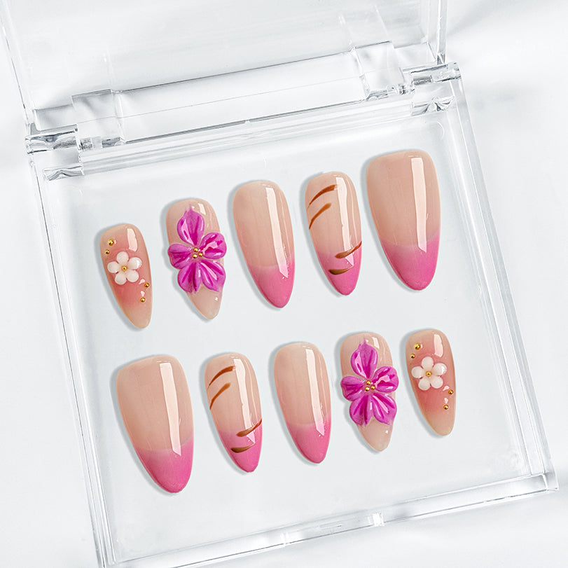 acrylic pink almond nails medium almond press-on nails with nude base pink ombre french tips and small flower accents for prom spring beach party style