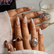 Ivory Cross Dot ALME0019 press-on nails hand model scene view 2