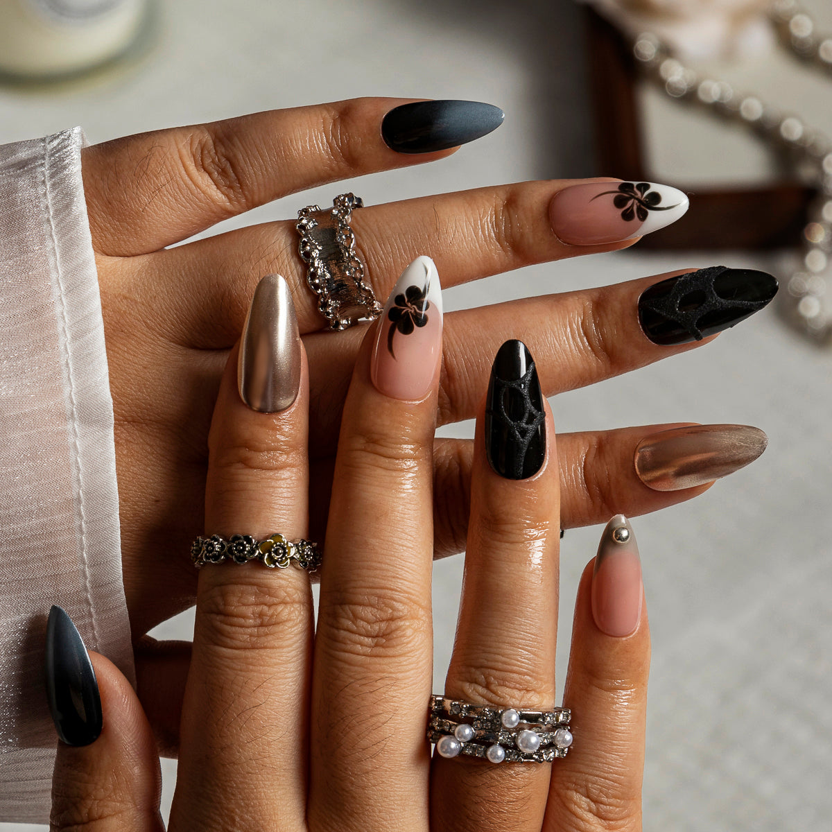 Champagne Noir Flower ALME0026 press-on nails hand model scene view 2