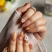 Peach Daisy Glow ALME0058 press-on nails hand model scene view 1