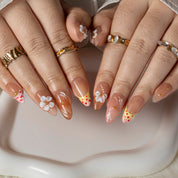Peach Daisy Glow ALME0058 press-on nails hand model scene view 2