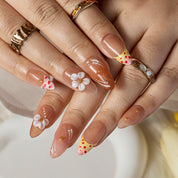 Peach Daisy Glow ALME0058 press-on nails hand model scene view 3