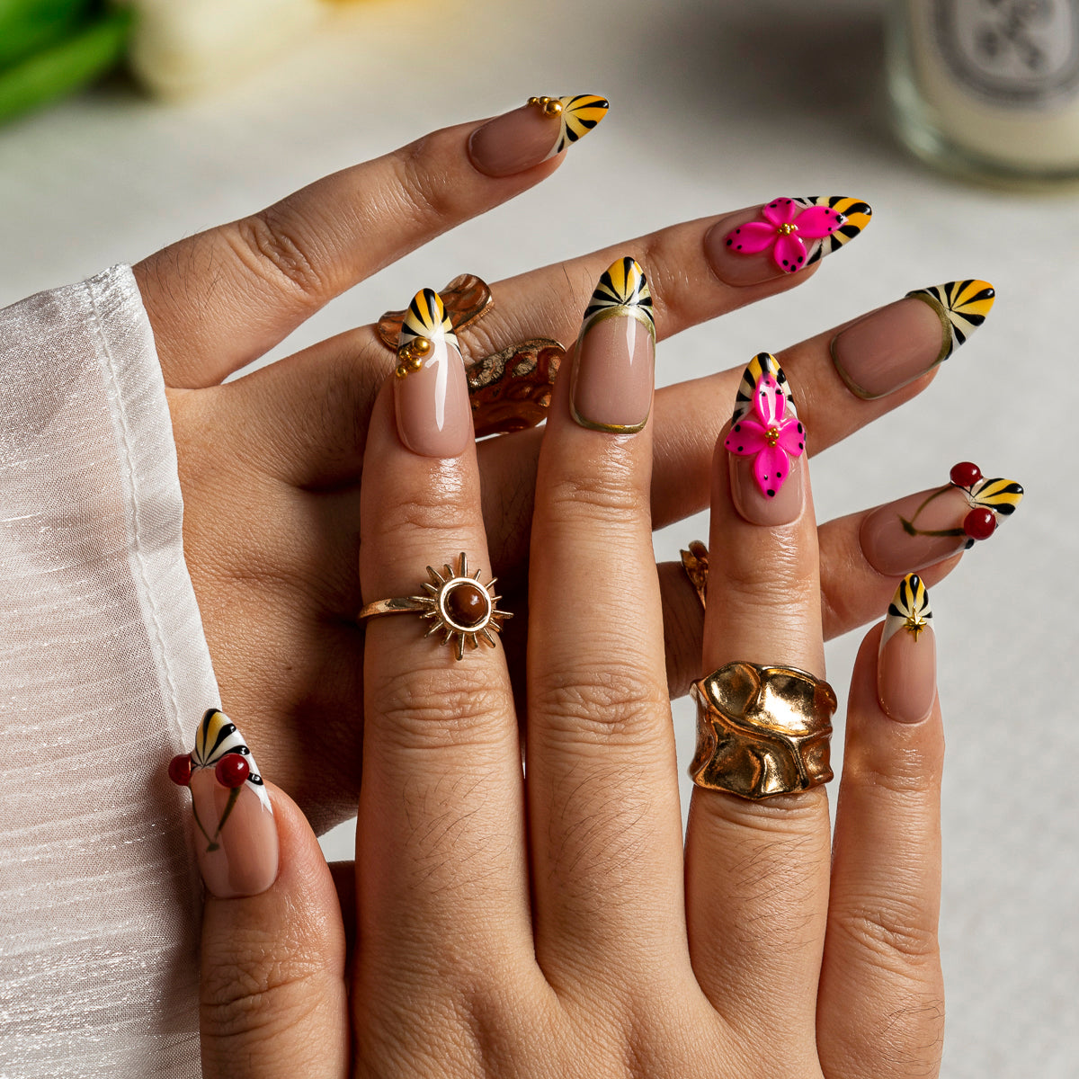 Fuchsia Sunburst Bloom ALME0065 press-on nails hand model scene view 1