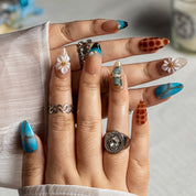 Turquoise Tortoise Bloom ALME0080 press-on nails hand model scene view 1