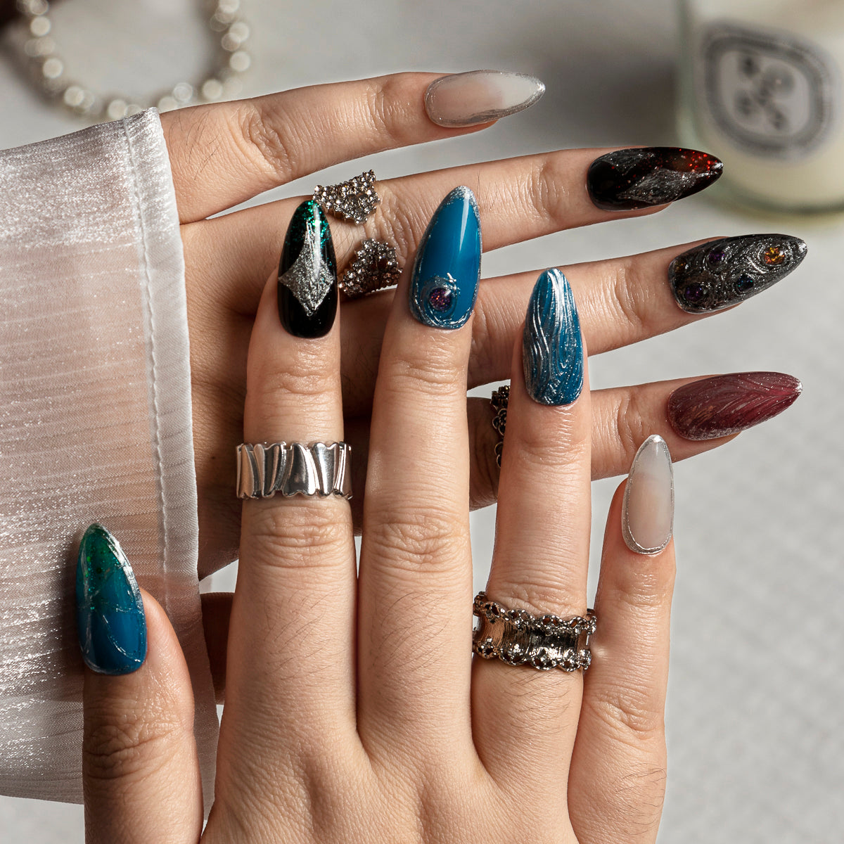 Teal Chrome Relic ALME0082 press-on nails hand model scene view 1