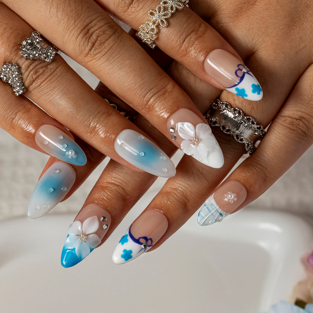 Blue Lace Bloom ALME0083 press-on nails hand model scene view 3