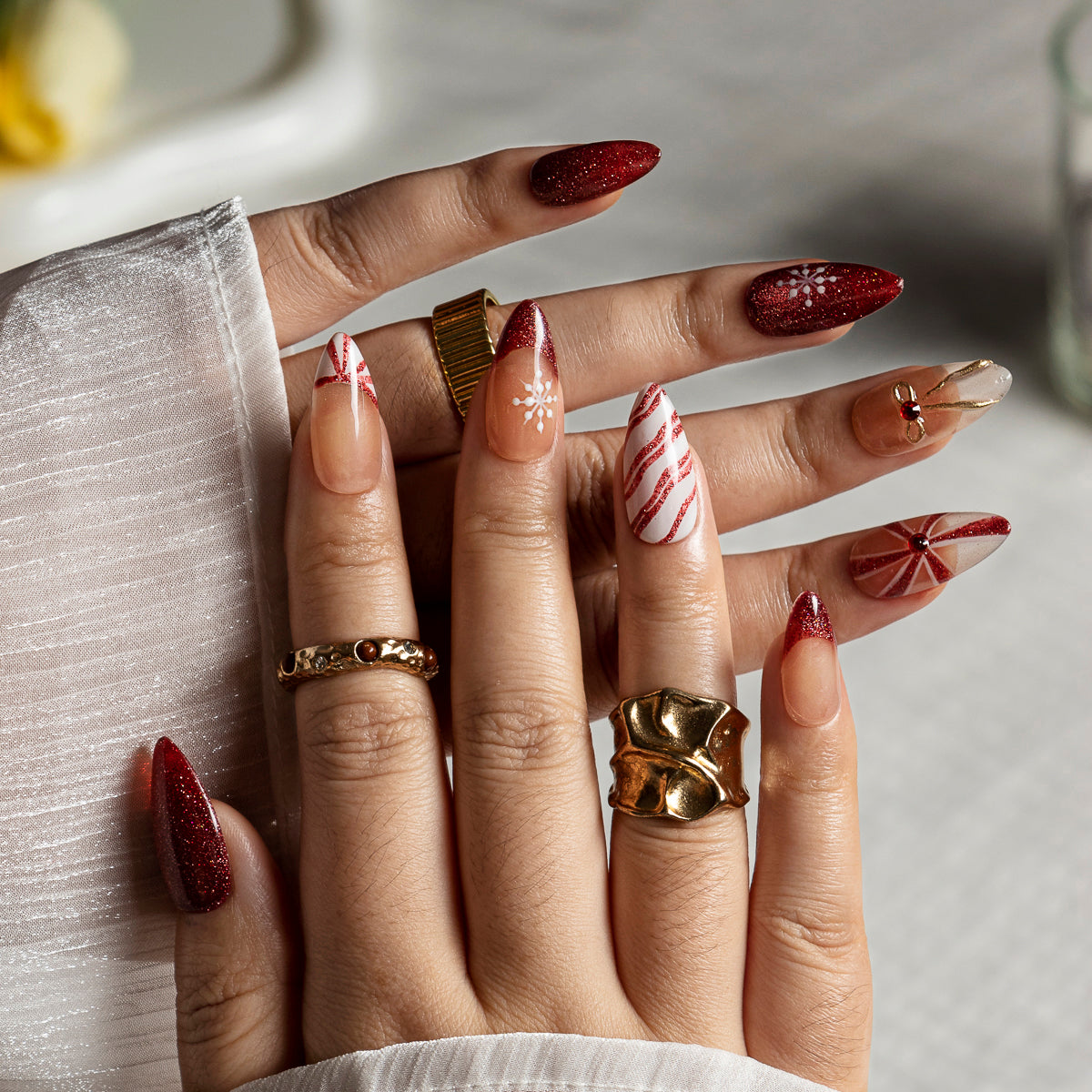 Burgundy Ribbon Snow ALME0108 press-on nails hand model scene view 1