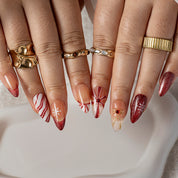 Burgundy Ribbon Snow ALME0108 press-on nails hand model scene view 2
