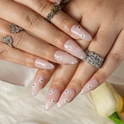 Pearl Petite Daisy ALME0133 press-on nails hand model scene view 3