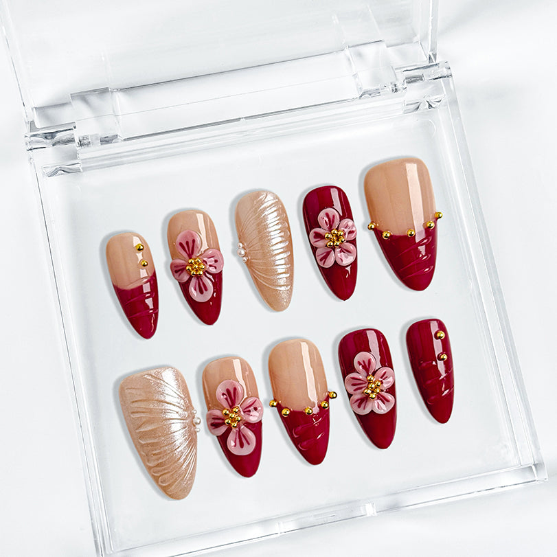 almond nails red medium almond press-on nails with hand-painted pink flowers and pearl accents for summer and beach parties