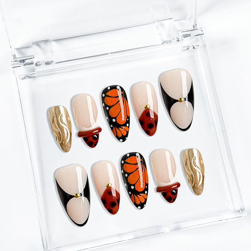 black and orange nails medium almond press-on nails with brown tones gold metallic luster and graphic accents for summer beach party prom winter style