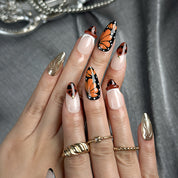 black and orange nails medium almond press-on nails with brown tones gold metallic luster and graphic accents for summer beach party prom winter style