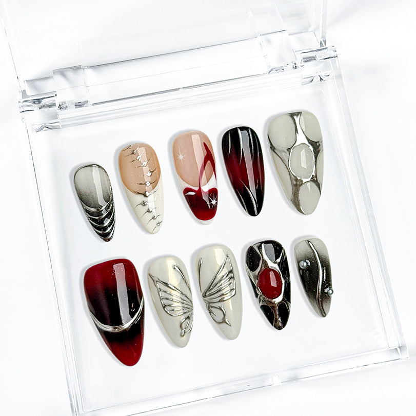 black silver glitter nails medium almond press-on nails in black and white with metallic silver luster winter holiday cool style