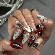 black silver glitter nails medium almond press-on nails in black and white with metallic silver luster winter holiday cool style