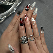 black silver glitter nails medium almond press-on nails in black and white with metallic silver luster winter holiday cool style