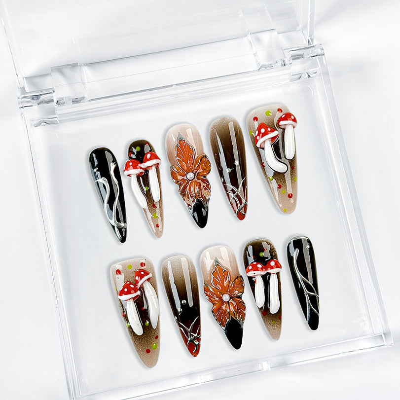 black silver nail art long stiletto press-on nails with black orange flower accents for fall winter holiday