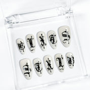 Black and white french nails, gothic blackletter dagger.