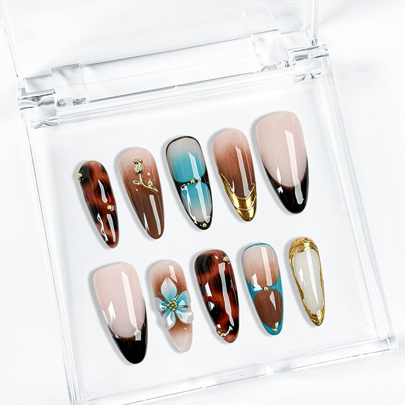 black with gold nails long almond press-on nails with blue brown flower and metallic gold details