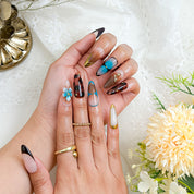 black with gold nails long almond press-on nails with blue brown flower and metallic gold details