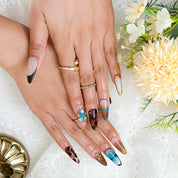 black with gold nails long almond press-on nails with blue brown flower and metallic gold details