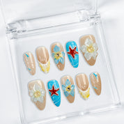blue and pink nail designs medium almond nude press-on nails with floral accents and French tip detail