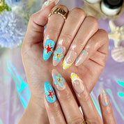 blue and pink nail designs medium almond nude press-on nails with floral accents and French tip detail