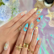 blue and pink nail designs medium almond nude press-on nails with floral accents and French tip detail
