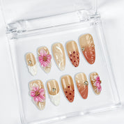 brown nude nails medium almond press-on nails with pink flower accents and soft orange detail