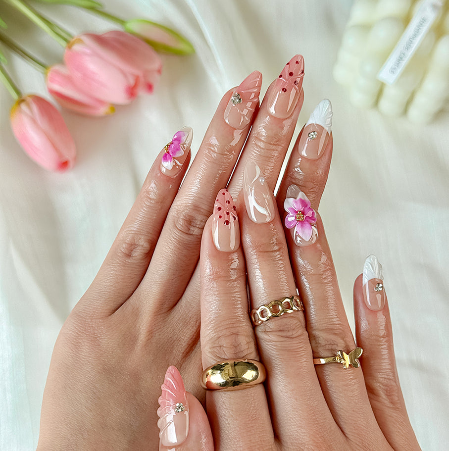 brown nude nails medium almond press-on nails with pink flower accents and soft orange detail