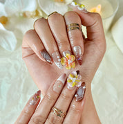 brown nude nails medium almond press-on nails with white yellow flower accents for wedding prom fall winter