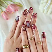 burgundy gold nails short square brown red press-on nails with flower accents and French tip detail