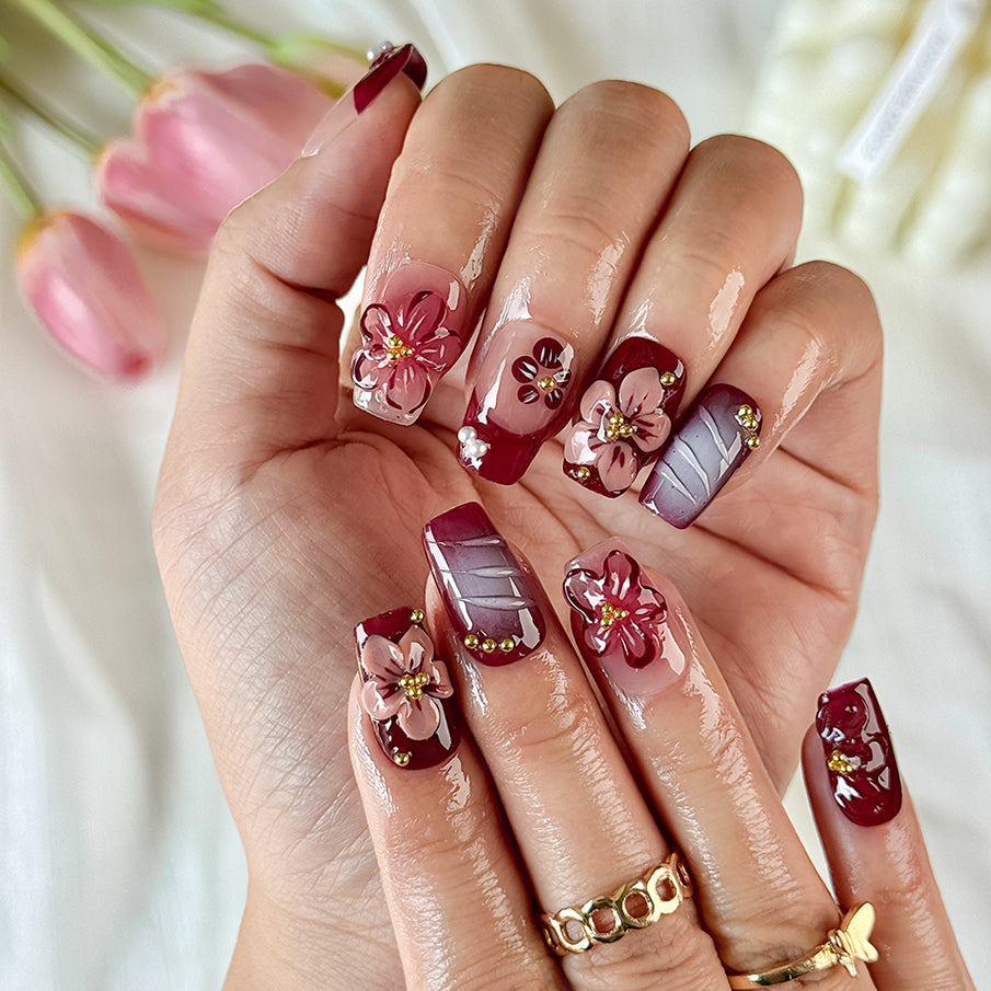burgundy gold nails short square brown red press-on nails with flower accents and French tip detail