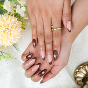 burgundy nail paint medium almond press-on nails with nude base French tip design and simple star nail art for fall prom