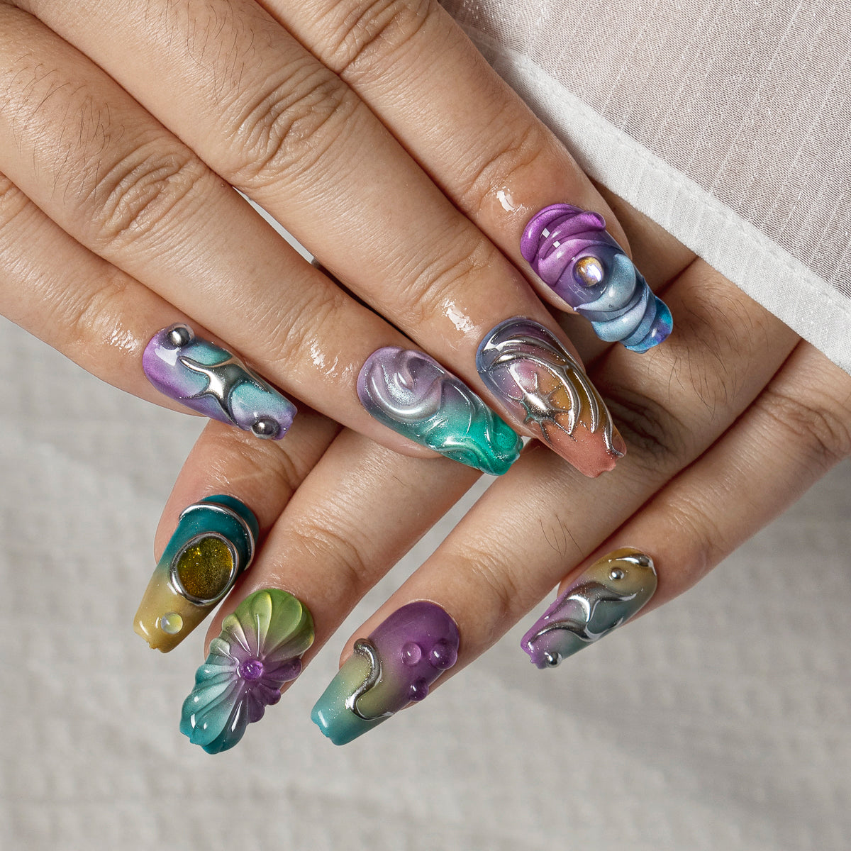 Prismatic Chrome Wave COME0034 press-on nails hand model scene view 2