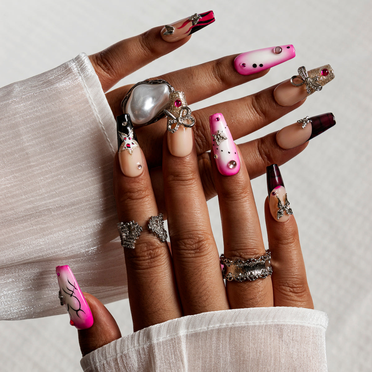 Pink Noir Butterfly COME0035 press-on nails hand model scene view 1