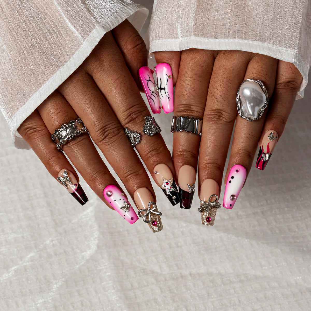 Pink Noir Butterfly COME0035 press-on nails hand model scene view 2