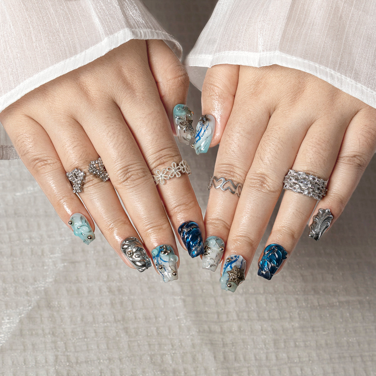 Arctic Blue Chrome COSH0009 press-on nails hand model scene view 1