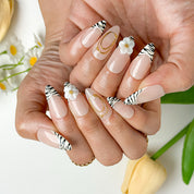 flower summer nails medium almond press-on nails with nude base, zebra french tips, and white 3D flower accents