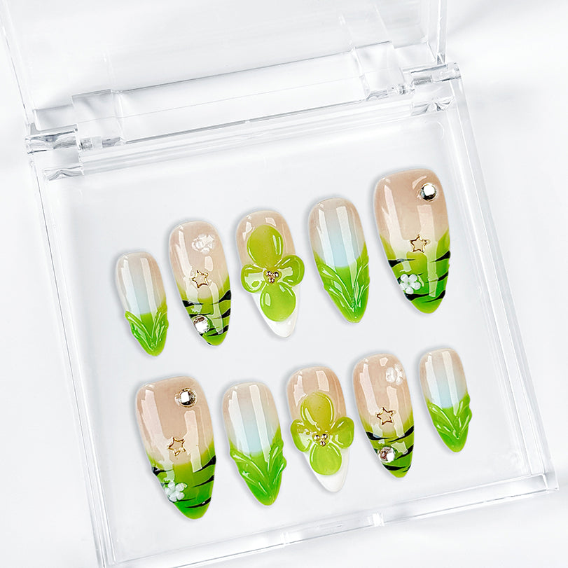 green flower nails medium almond nude press-on nails with floral accents and green French tip design