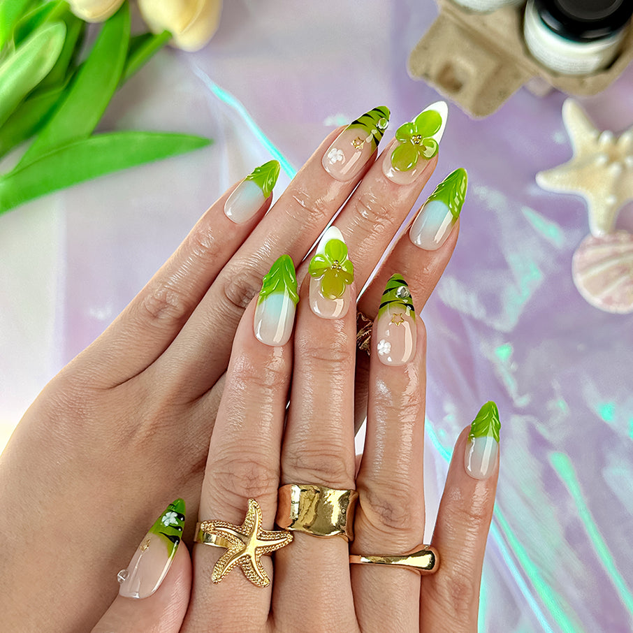 green flower nails medium almond nude press-on nails with floral accents and green French tip design