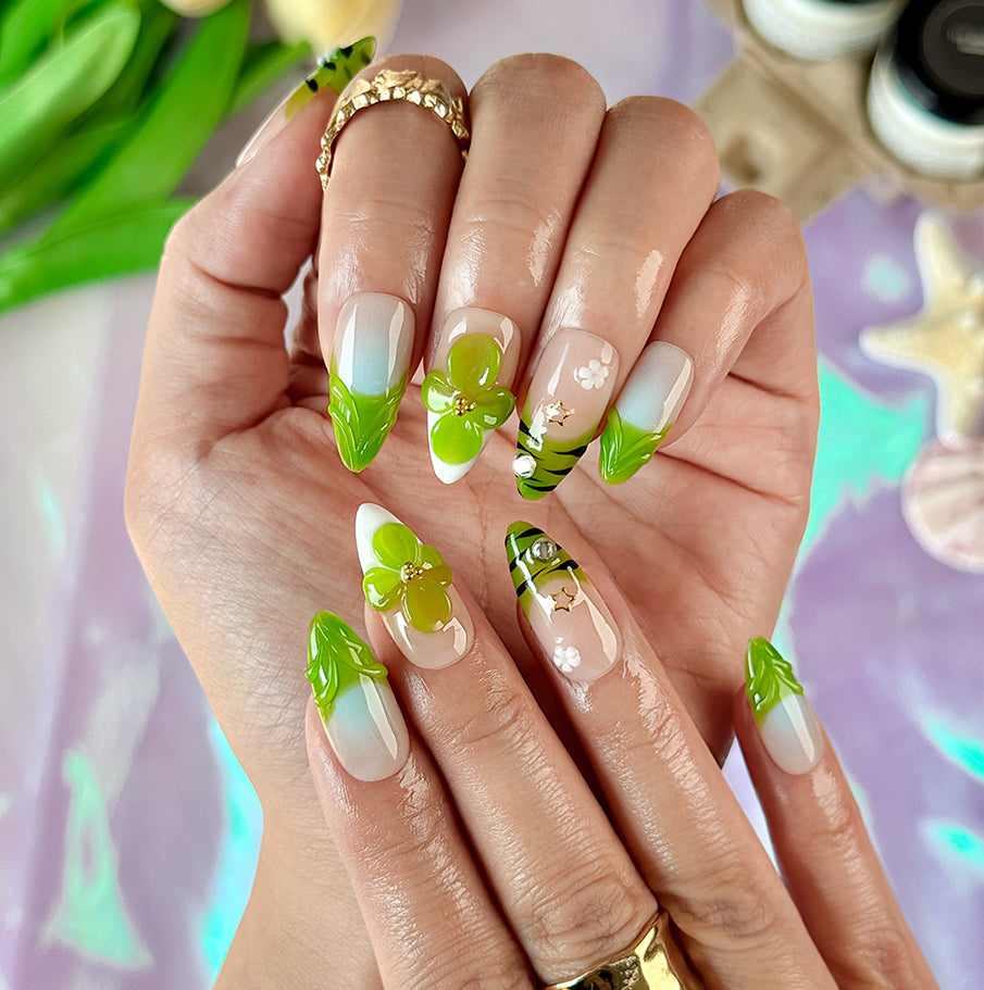 green flower nails medium almond nude press-on nails with floral accents and green French tip design