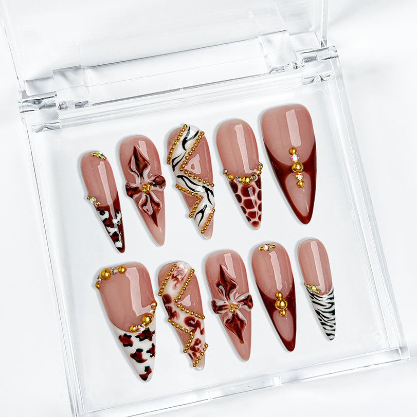 light pink almond nails long stiletto press-on nails with rosy nude base brown red accents french tips flower detail and luxury bling for prom fall winter style