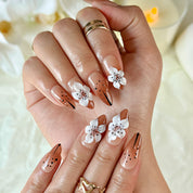 light brown nail medium almond press-on nails with white flower detail for holiday prom fall winter