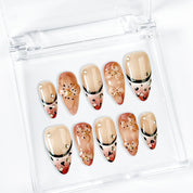 light brown nail medium almond nude brown press-on nails with flower accents and French tip detail