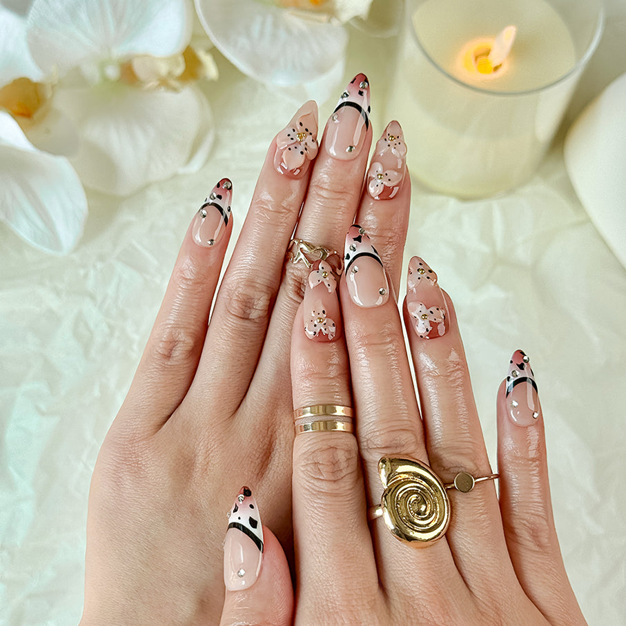 light brown nail medium almond nude brown press-on nails with flower accents and French tip detail