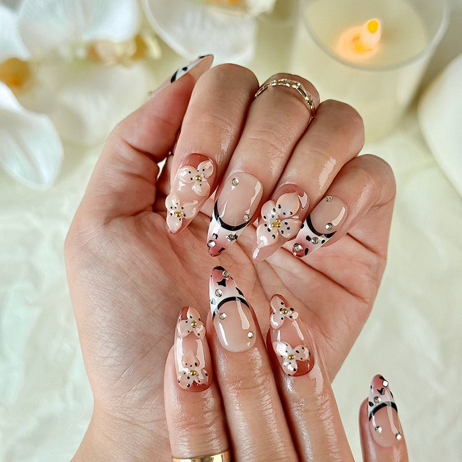 light brown nail medium almond nude brown press-on nails with flower accents and French tip detail