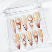 nail art white flowers long stiletto nude red press-on nails with French tip and floral detail