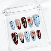 spotty nail art medium almond blue red French tip press-on nails with polka dots and star design