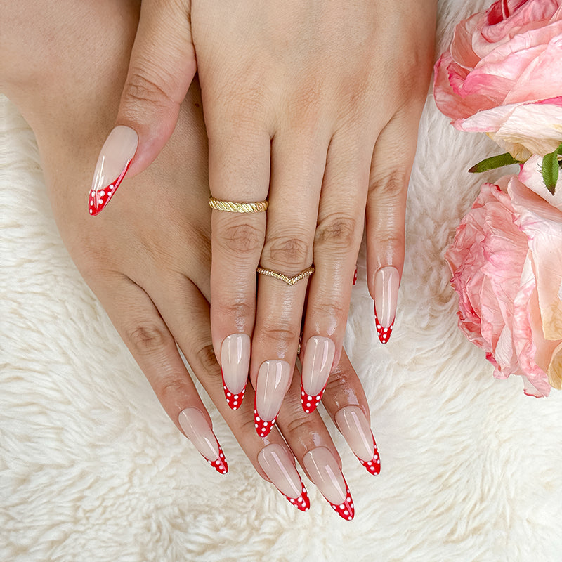 nail designs zebra inspired nude long almond press-on nails with red french tips and white polka dots for summer and prom
