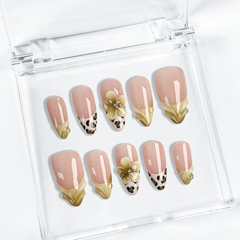 nail designs zebra medium almond nude press-on nails with yellow french tips, leopard-style accents, and 3D flower for summer beach party